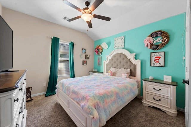 bedroom with ceiling fan, lofted ceiling, and dark colored carpet