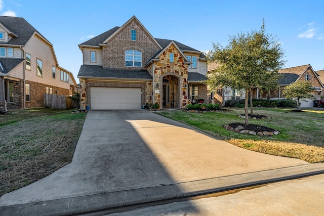 view of front facade with a garage and a front yard