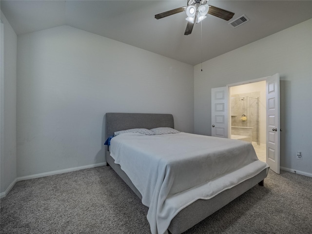 bedroom featuring vaulted ceiling, carpet flooring, connected bathroom, and ceiling fan