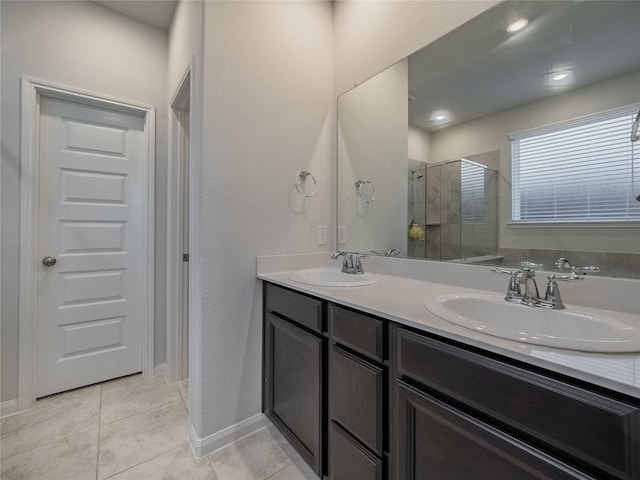 bathroom with walk in shower and vanity