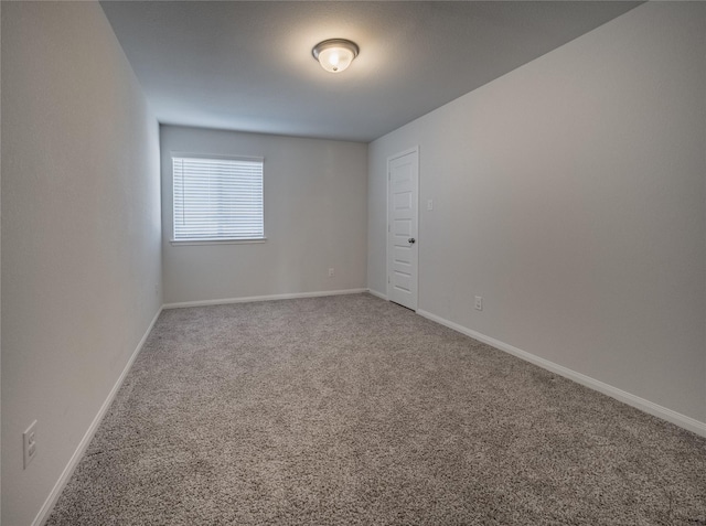 unfurnished room with carpet flooring