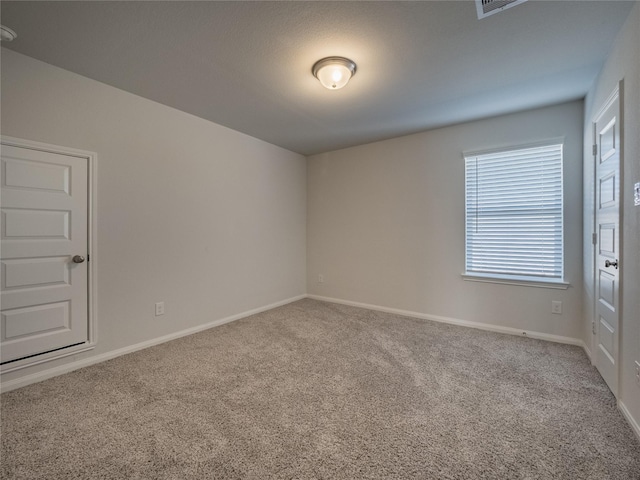 empty room with carpet flooring