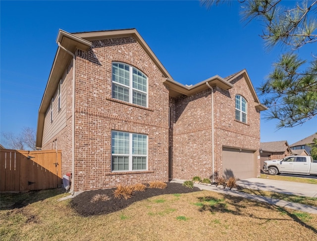 view of front facade with a garage and a front yard