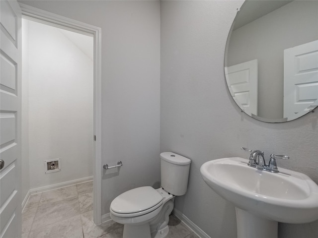 bathroom featuring sink and toilet