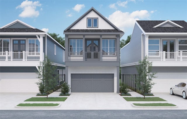 raised beach house featuring a garage and a balcony