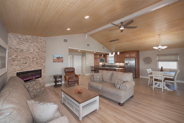 living room with light wood-type flooring, wood ceiling, visible vents, and a stone fireplace