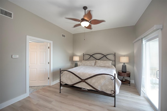 bedroom with light wood-style floors, baseboards, visible vents, and ceiling fan