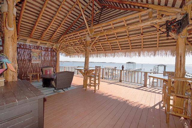 deck with a water view and a gazebo