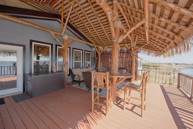 deck with outdoor dining area