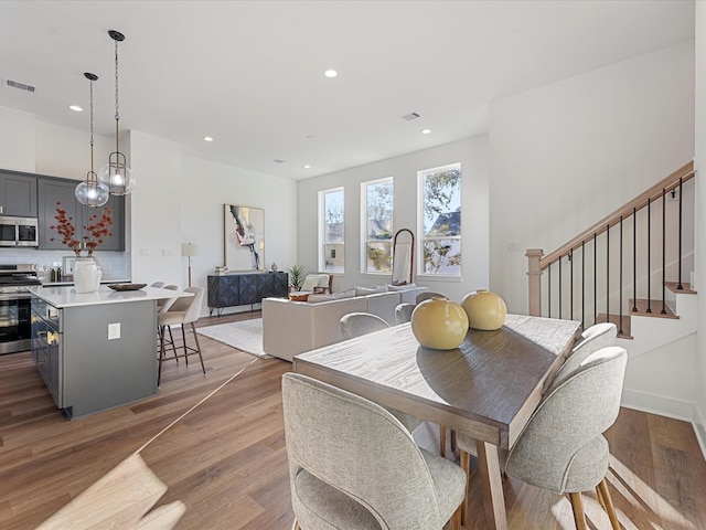 dining area with wood-type flooring