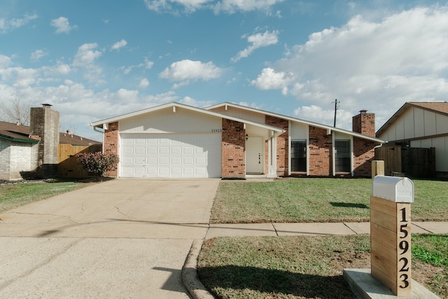 ranch-style house featuring a garage and a front lawn