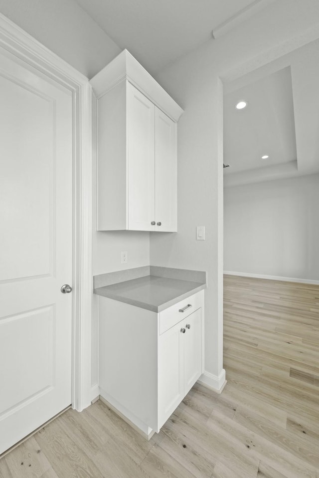 interior space with recessed lighting, light wood-type flooring, and baseboards