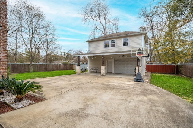 view of side of home featuring a garage and a yard