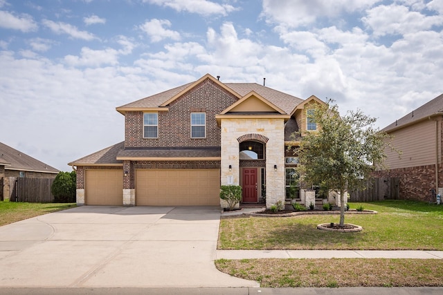 view of front of house featuring a garage and a front lawn