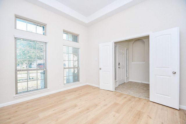 empty room with light hardwood / wood-style floors