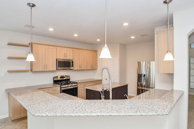 kitchen featuring appliances with stainless steel finishes, light brown cabinetry, sink, hanging light fixtures, and kitchen peninsula