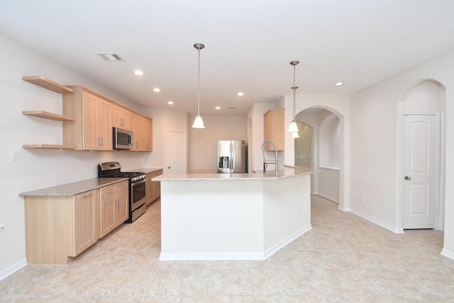 kitchen featuring sink, hanging light fixtures, light stone counters, stainless steel appliances, and light brown cabinets