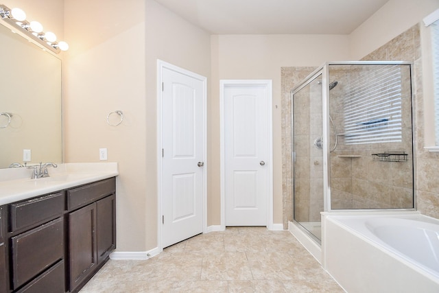 bathroom with independent shower and bath, vanity, and tile patterned floors