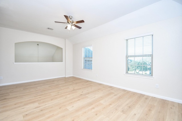 unfurnished room featuring ceiling fan, light hardwood / wood-style flooring, and a healthy amount of sunlight