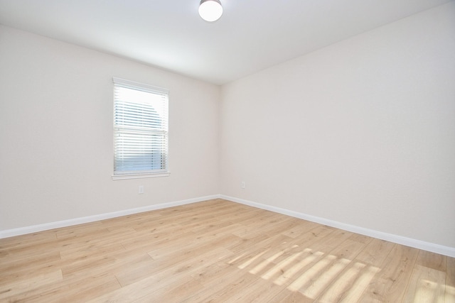 unfurnished room featuring light wood-type flooring