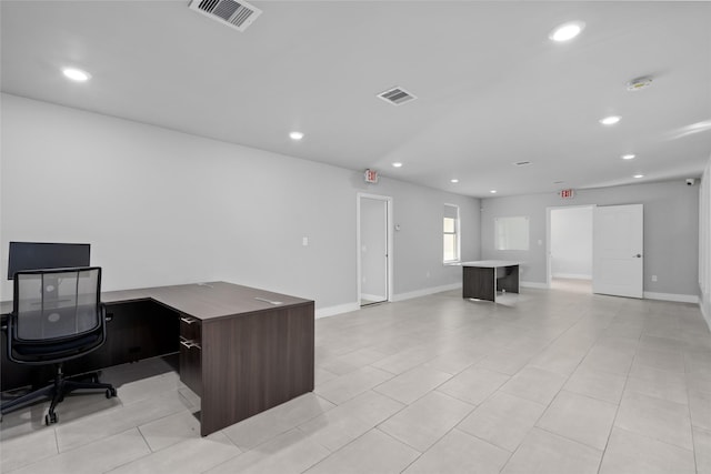 office space with light tile patterned floors