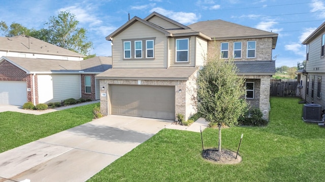 view of front of home with a garage, central AC unit, and a front yard