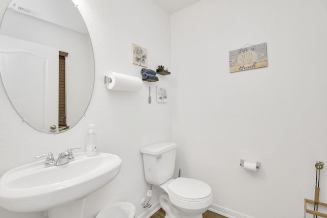 bathroom with sink and toilet