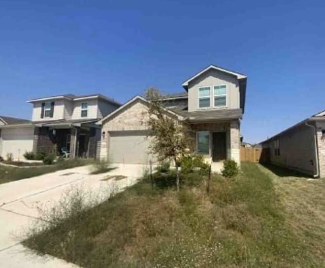 view of front of house featuring a front yard and a garage