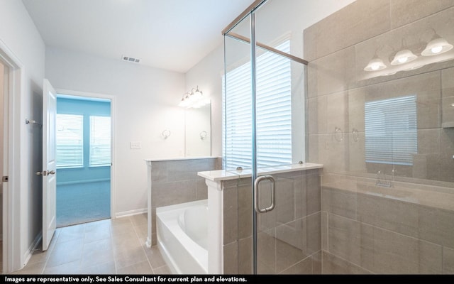 bathroom featuring separate shower and tub and tile patterned flooring