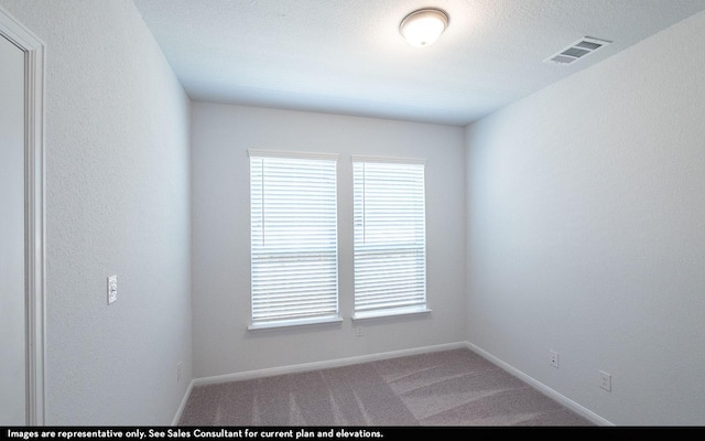 unfurnished room featuring carpet flooring