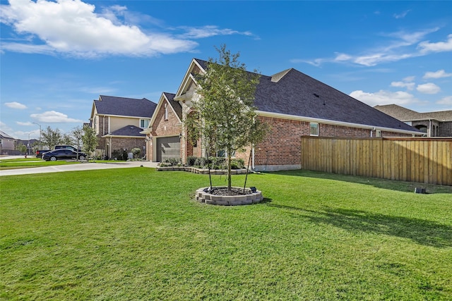 exterior space featuring a garage and a yard