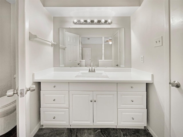 bathroom featuring toilet and vanity