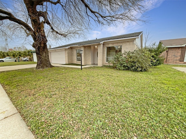 single story home featuring a front yard and a garage