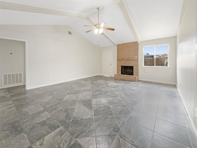 unfurnished living room with a fireplace, wood walls, vaulted ceiling with beams, and ceiling fan