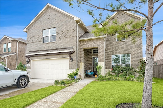 view of front of house with a garage and a front yard