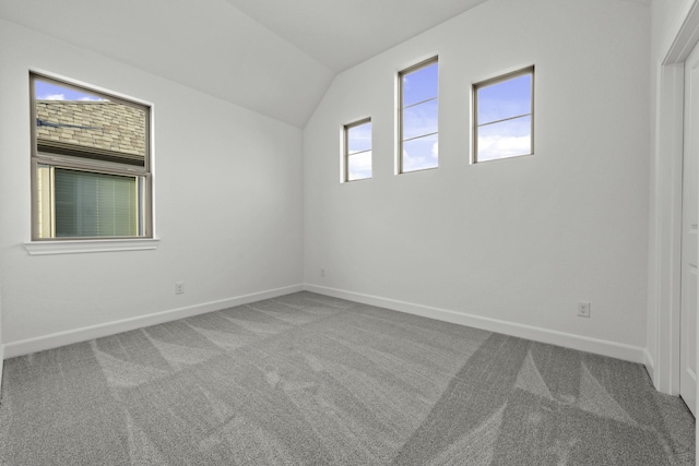 bonus room with lofted ceiling, carpet, and baseboards