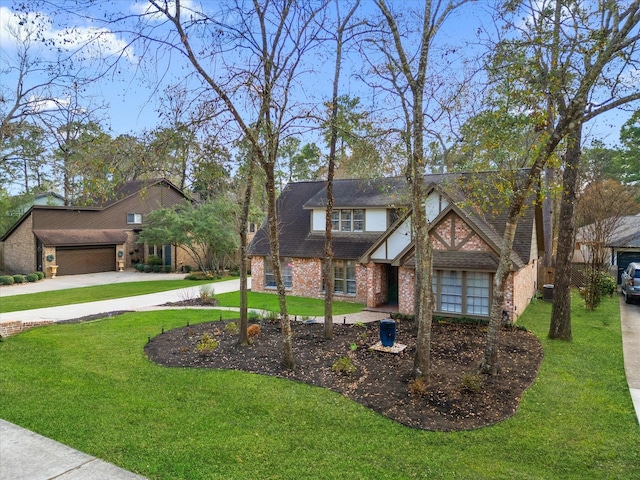 view of front of home featuring a garage and a front yard