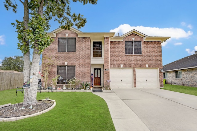 view of front facade with a front yard and a garage