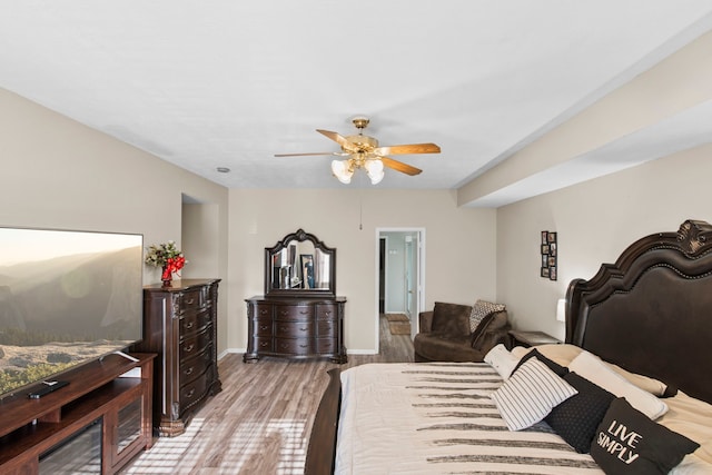 1711 Village Court Ln, Rosenberg, TX 77471 - bedroom featuring ceiling fan, baseboards, and wood finished floors