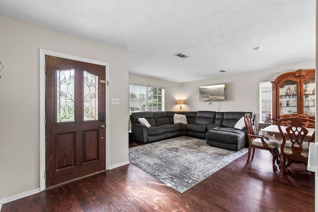 1711 Village Court Ln, Rosenberg, TX 77471 - living room featuring wood finished floors, visible vents, and baseboards