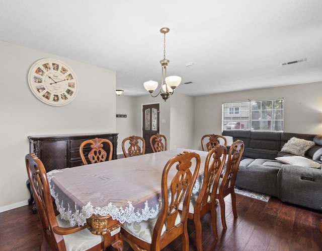 1711 Village Court Ln, Rosenberg, TX 77471 - dining space featuring hardwood / wood-style floors, baseboards, visible vents, and a chandelier
