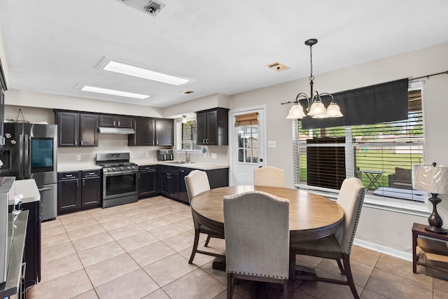 1711 Village Court Ln, Rosenberg, TX 77471 - dining room featuring visible vents, a notable chandelier, and light tile patterned floors