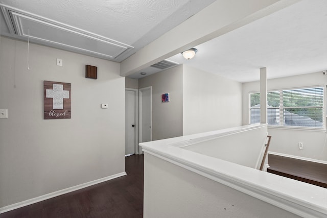 1711 Village Court Ln, Rosenberg, TX 77471 - hall with attic access, dark wood-type flooring, visible vents, and baseboards