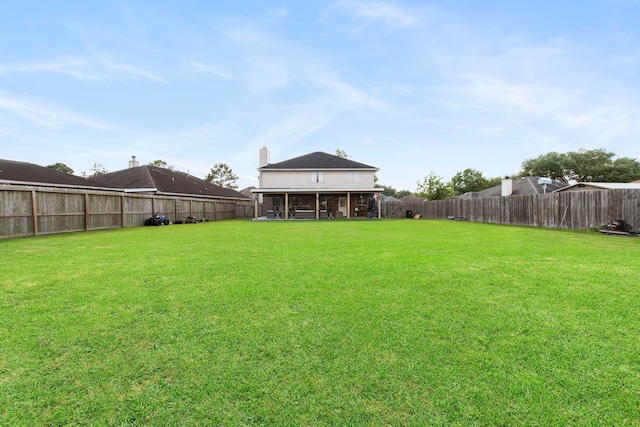 1711 Village Court Ln, Rosenberg, TX 77471 - view of yard with a fenced backyard and a sunroom