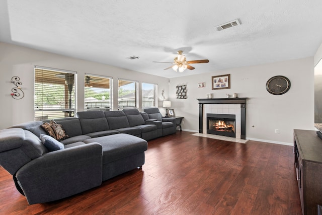 1711 Village Court Ln, Rosenberg, TX 77471 - living room with dark wood finished floors, a ceiling fan, and visible vents