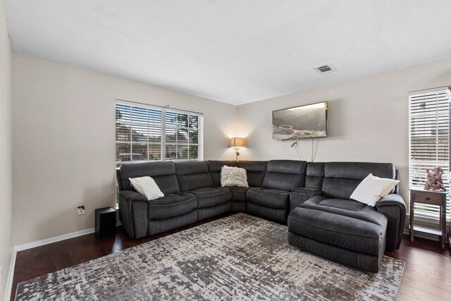 1711 Village Court Ln, Rosenberg, TX 77471 - living area with baseboards, wood finished floors, and visible vents