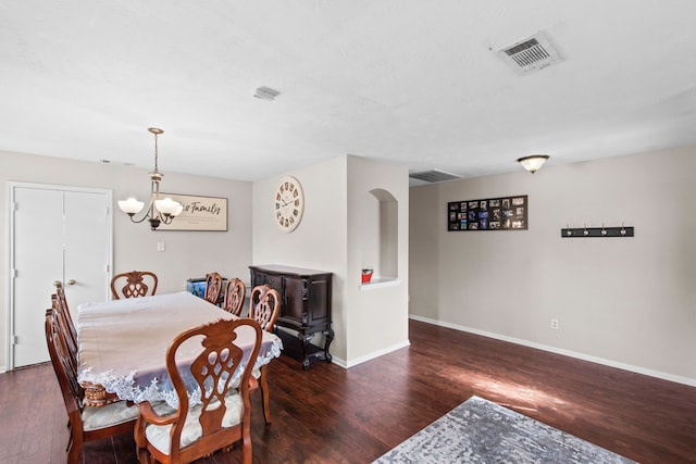 1711 Village Court Ln, Rosenberg, TX 77471 - dining space with baseboards, wood finished floors, visible vents, and a notable chandelier