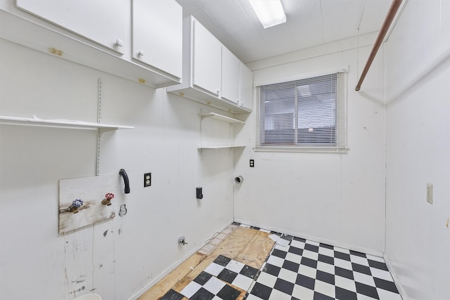 laundry area featuring washer hookup, gas dryer hookup, and cabinets