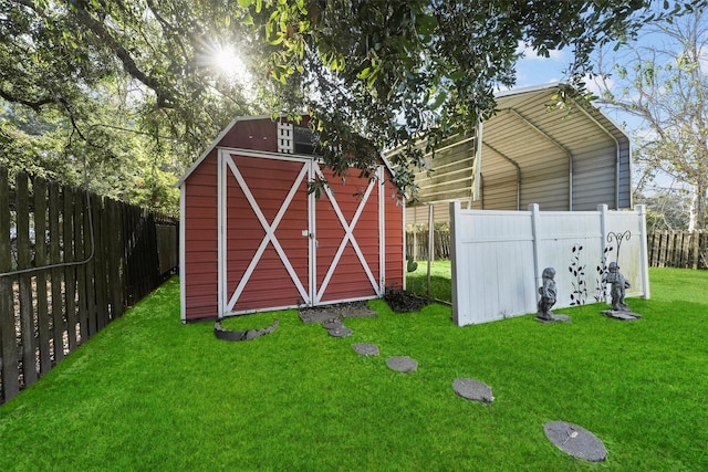 view of outbuilding featuring a lawn and a carport