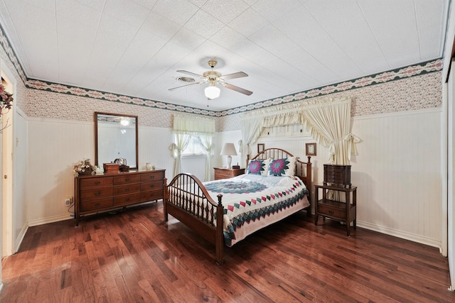 bedroom featuring ceiling fan and dark hardwood / wood-style floors